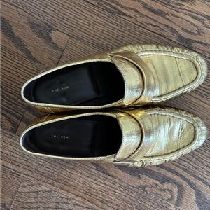 THE ROW GOLD LOAFERS
